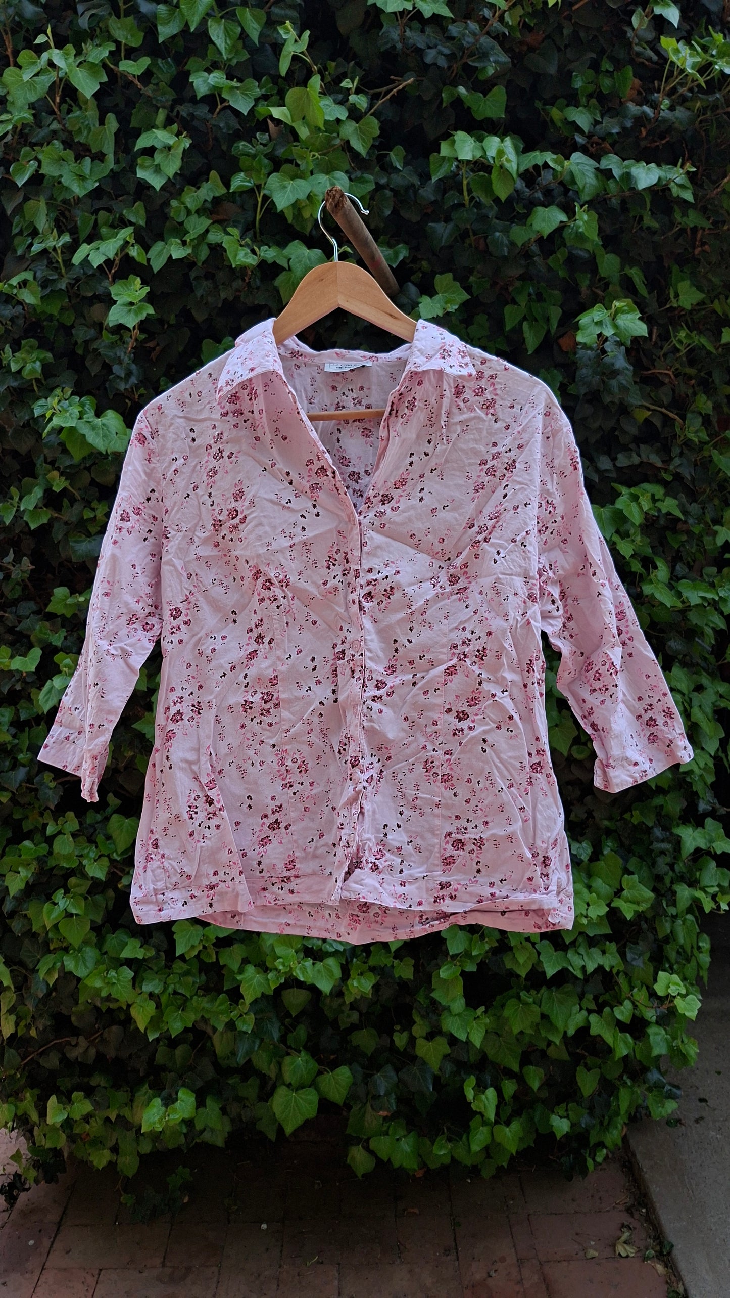 Floral-patterned shirt on a green leafy background