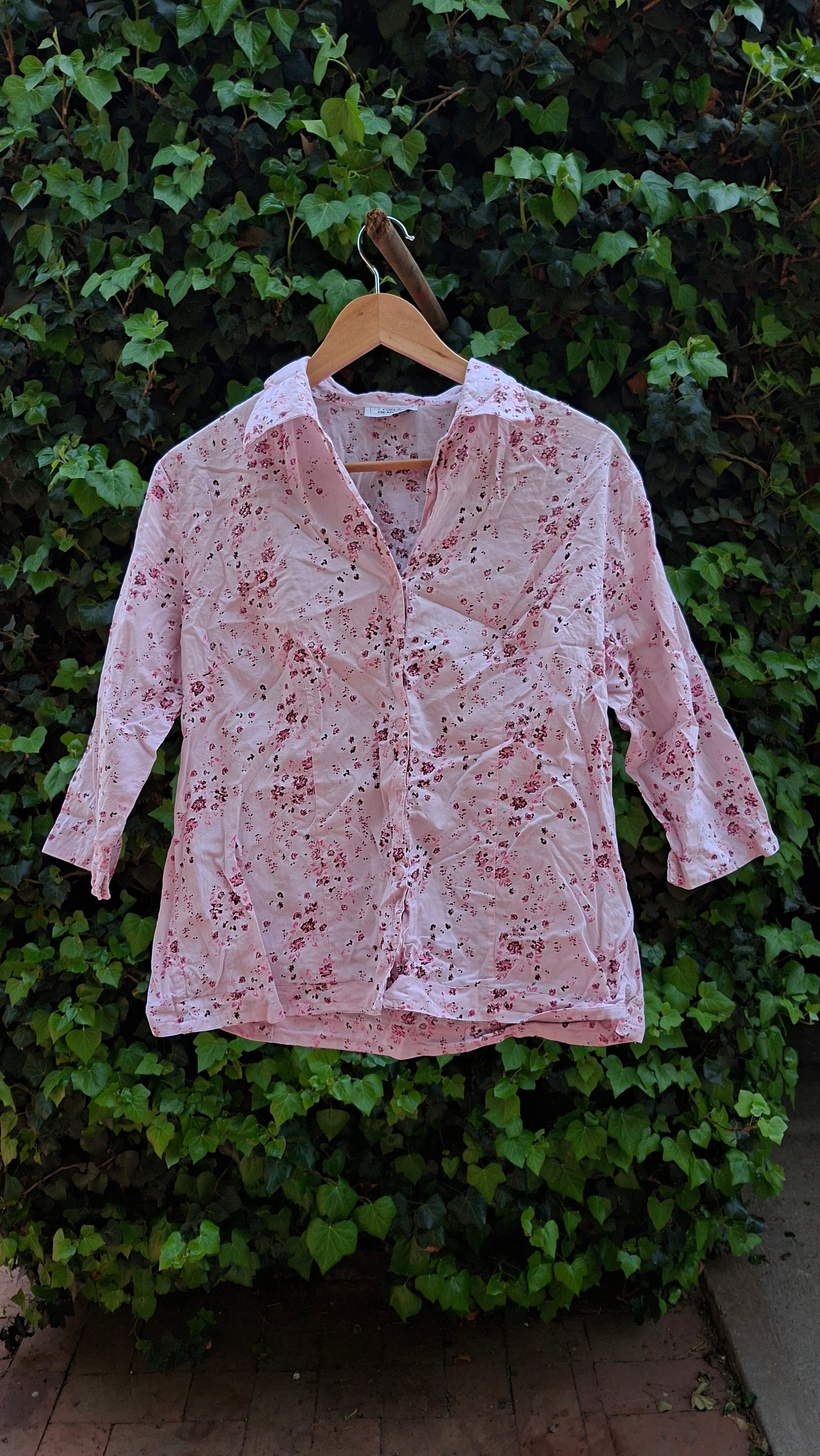 Floral-patterned shirt on a green leafy background